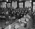 American Lieutenant Colonel Hal. D. McCown is sworn in as a witness for the defense at the trial of 74 SS men charged with perpetrating the Malmedy atrocity.