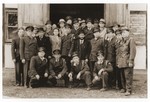 Group portrait of Jewish DP police and others from the Lechfeld displaced persons camp at a memorial ceremony in Dachau.
