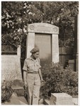 Amos Elhanan, a member of the Jewish Brigade, poses in front of the tomb of Theodor Herzl in Vienna.