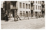 View of the entrance to the "Gypsy camp" on Brzezinska Street in the Lodz ghetto after its liquidation.