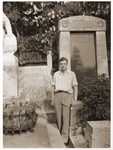 George Birman poses in front of the tomb of Theodor Herzl in Vienna.