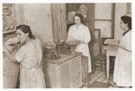 Three women working in a bakery in the Lodz ghetto.