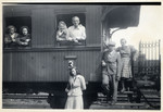 A German Jewish couple looks out the window of a train [perhaps in advance of their departure to the United States on board the Marine Perch.]

Pictured are Fritz and Jachet Sauerbrunn looking out the train window on the right.
