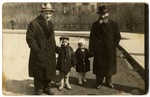A Polish Jewish family walks on the Planty in Krakow.