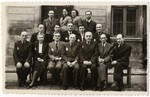 Group portrait of the employees of the Zentral Einkaufstelle, the central supply warehouse of the ghetto which provided raw materials to the other ghetto workshops.