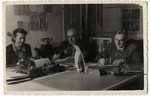 The directors of the Zentral Einkaufstelle, the central purchasing department of the ghetto, work at their desk.