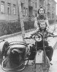 Chuma Rendler and a friend sit on a motorcycle in the Tempelhof DP camp.