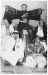 A group of Jewish teenagers pose wearing costumes [possibly for a Hannukah party].