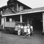 German Jewish refugee Ruth Weyl poses outside a store in Kampala, Uganda with members of an English family who befriended her.