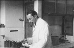 Otto Giniewski, a leader of the French Zionist underground, works in his chemistry laboratory at the University of Grenoble.