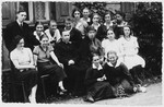 Group portrait of Polish and Jewish students and their teachers at a gymnasium in Lukow, Poland.