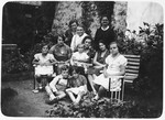 Prewar portrait of the Mittelman family in the garden of their home in Brezno.