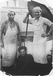 Zdenek Mermelstein (right) poses with fellow workers in the kitchen of the Gabersee displaced persons camp.