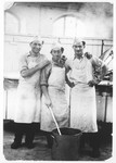 Zdenek Mermelstein (right) poses with two friends in the kitchen of the Gabersee displaced persons camp.