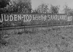 The anti-Semitic graffiti painted on the wall of the Jewish cemetery reads, "The death of the Jews will end the Saarland's distress."