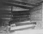 A room filled with unused wooden coffins in Bergen Belsen.