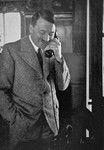 Adolf Hitler speaks on the telephone with Gauleiter Joseph Buerckel after the Saar plebiscite determined that the region would remain a part of Germany.