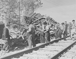 Members of the Maquis of Voireppe in the Chartreuse Region of the French Alps look over the results of one of their derailment jobs.