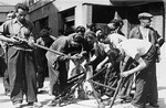 Members of the French resistance clean their weapons during the insurrection in Marseilles that was timed to coincide with the Allied invasion of southern France.