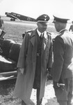 Reichsfuehrer-SS Heinrich Himmler greeting an unidentified person [probably at the airport in Paderborn].