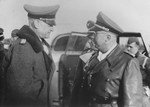Reichsfuehrer-SS Heinrich Himmler converses with SS-Obergruppen Fuehrer Alfred Wunnenberg.