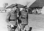 Reichsfuehrer-SS Heinrich Himmler (left) strolls through a village in the company of Waffen-SS Armored Division Wiking chief, SS-Brigadefuehrer and Major General Felix Steiner.