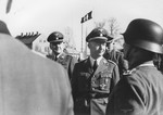 Reichsfuehrer-SS Heinrich Himmler [probably reviewing a unit of SS troops].