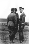 Heinrich Himmler consults with commanders of a Waffen SS calvary brigade in the eastern territories.