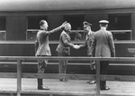 Reichsfuehrer-SS Heinrich Himmler shakes hands with Wilhelm Keitel on a train platform.