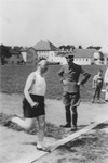 Heinrich Himmler runs across the finish line on an outdoor track at the SS officers school in Bad Tolz, Germany.