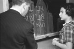 A Hebrew teacher at the Goldschmidt Jewish private school in Berlin-Grunewald instructs a pupil at the chalkboard.