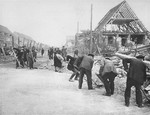 German civilians clear rubble at the Nordhausen concentration camp.