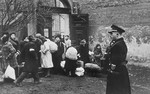 A German official supervises a deportation action in the Krakow ghetto.
