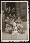 Bep Meijer (top left) with family and friends at the entrance to her family's home in Boekelo.
