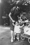 One-year-old Evelyn (Evy) Goldstein is taken for a walk in a Berlin park by her Aunt Ruth Thal.