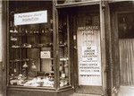 View of a perfume shop in Vienna with posted signs certifying that the enterprise is an Aryan firm.