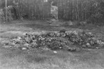 The personal effects of prisoners killed by the Germans lie in a pile on the grass in the Maly Trostinets concentration camp.