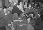 Women and children, many of whom are suffering from typhus, typhoid, and dysentary, in a barracks at Bergen-Belsen after liberation.