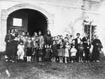 Group portrait of women and children in the Gornja Rijeka concentration camp.