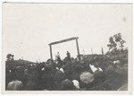 Spectators witness the public execution of Mosche Kogan and Wolf Kieper.