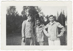Three young Buchenwald survivors pose in their uniforms after liberation.