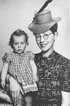Semmy Woortman poses with Lientje, a nine month old Jewish girl she was hiding in her home.