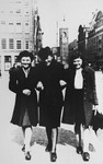 Semmy Woortman walks along a street in Amsterdam with her stepdaughter Hetty (left, Joop's daughter) and her Jewish foster child, Rachel (right).