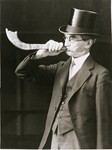 Portrait of a British Jew blowing a shofar during the high holidays.
