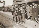 A group of Jewish DPs waits at the Vienna railroad station for a train to take them on the next leg of their journey along the Bricha route to the American Zone of Germany.