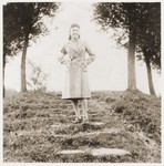 A Jewish girl, wearing an armband, poses in a park in Zabno.