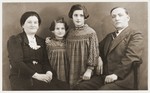 Studio portrait of a family of German Jews of Polish origin, who were forced to return to Poland in 1938.