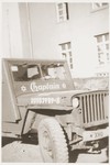 A jeep belonging to an American Jewish army chaplain who is visiting the Kibbutz Nili hachshara (Zionist collective) in Pleikershof, Germany.