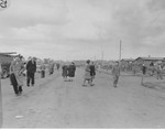 Survivors on a street in Bergen-Belsen.