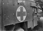 View of a British military ambulance with gun-fire damage.